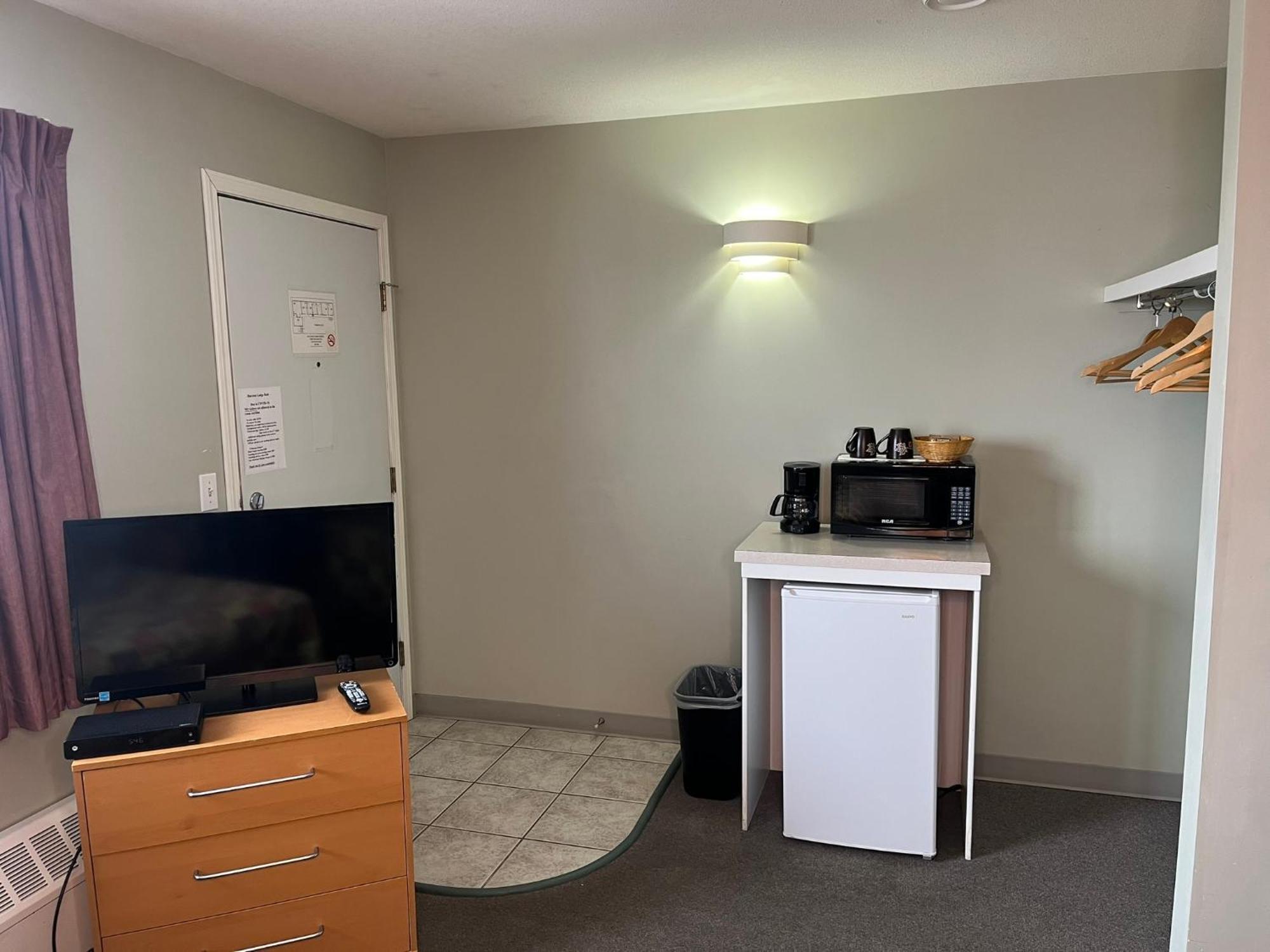 Raccoon Lodge Motel Sylvan Lake Rom bilde
